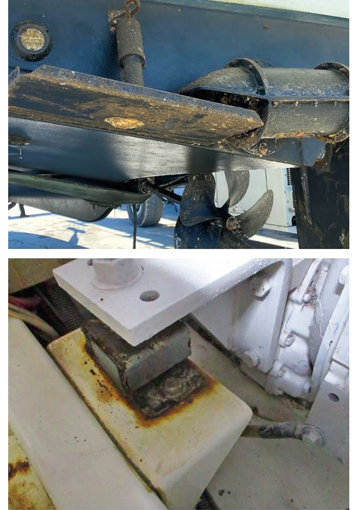 Photo of a trim tab was frozen due to underwater growth and a rusted engine mount.
