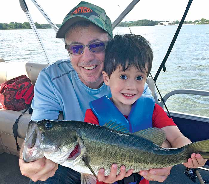 Charlie and son Max show off a 3-pound largemouth