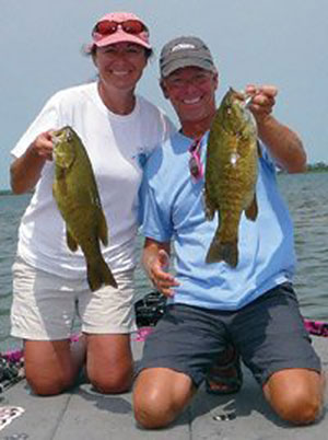 Kerry and Kevin Short with a pair of smallmouth bass from Lake Michigan