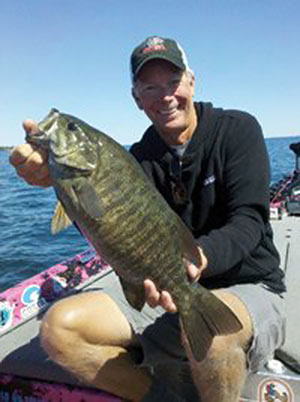 Kevin Short with a smallmouth caught on Lake Ontario
