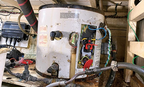 Rusted, old and damaged white water heater