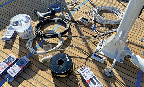 Mast and boom with various electronics and wiring prior to project. 