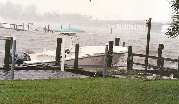 Photo of a swamped powerboat tied to the dock