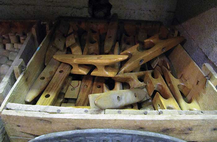 Wood cleats sitting on a wood shelf in an old wooden box