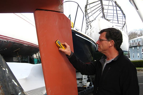 Marine Surveyor Inspecting a Boat