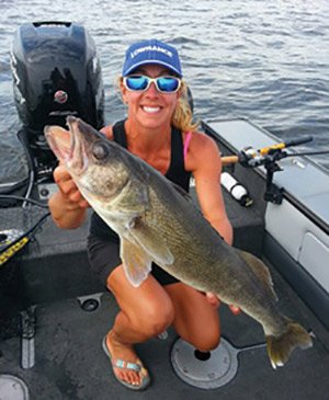 Marianne Huskey Holding Up a Walleye