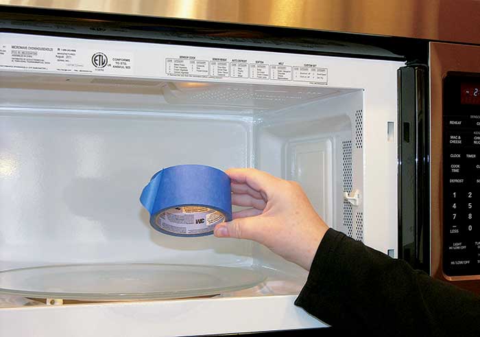 Putting masking tape in a microwave