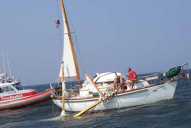 What Should You Look Out For When Launching A Sailboat With A Raised Mast?