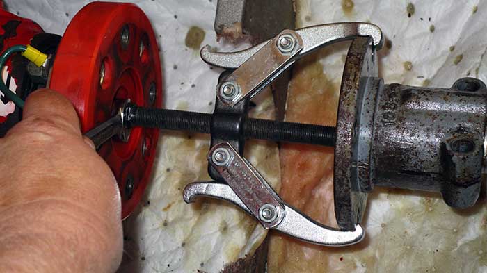 Undoing clamps that hold old stuffing box