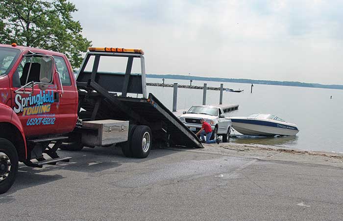 Setting up t otow a broken down truck and trailered boat