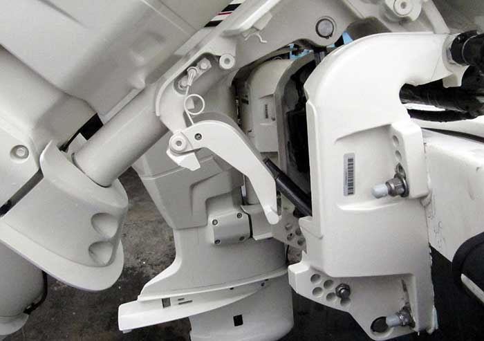Evinrude outboards use a lock arm instead of a traditional transom saver that attaches to the trailer frame and outboard