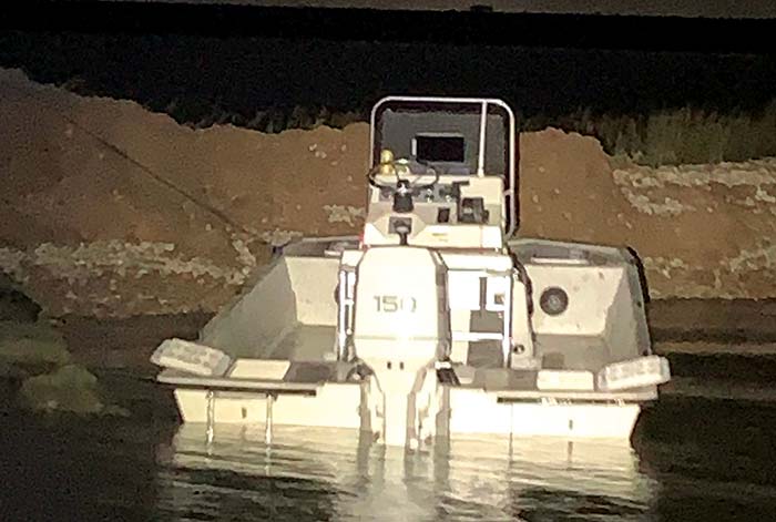 21-foot flat-bottom powerboat struck a rock and ran aground at night
