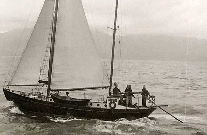 A 45-foot yawl with four men aboard, out at sea during a storm