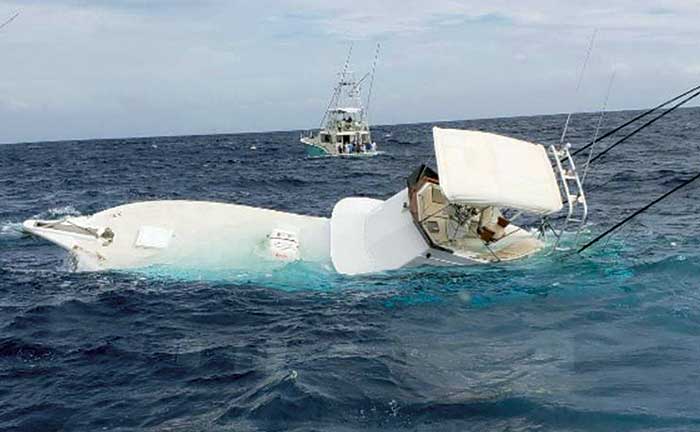 Sinking powerboat off the coast of Hawaii