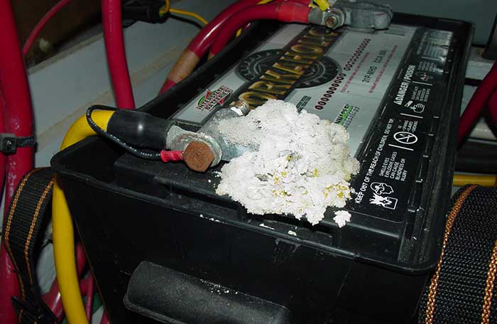 Boat generator start battery with white corrosion growing on the battery terminal