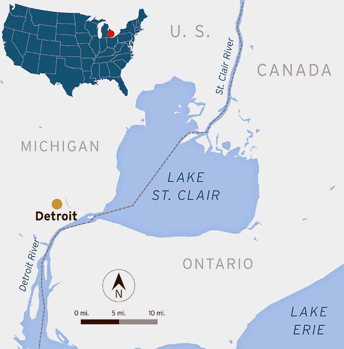 Lake St. Claire map also showing a silhoutte map of the United States in  blue with a red dot marking where the lake is on the map