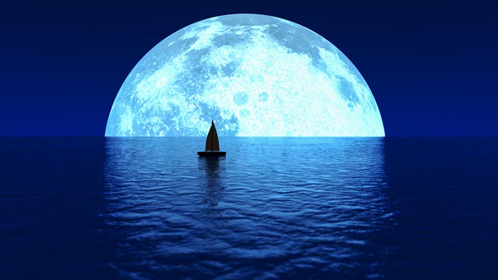 Illustration of a silhouette of a sailboat on blue calm waters with a large blue moon on the horizon