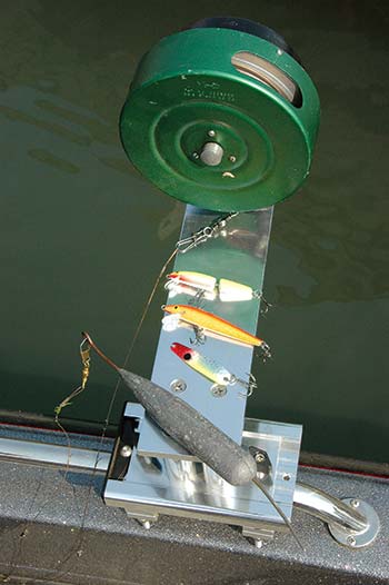 The terminal end of a traditional handline rig, with the weight trailing a shank of line attached to a lure