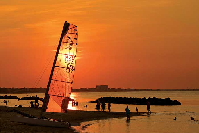 Photo Contest Boating Lifestyle Finalist: Image of the beach along the Chesapeake Bay in Norfolk, Virginia, bustling with activity as the sun sets