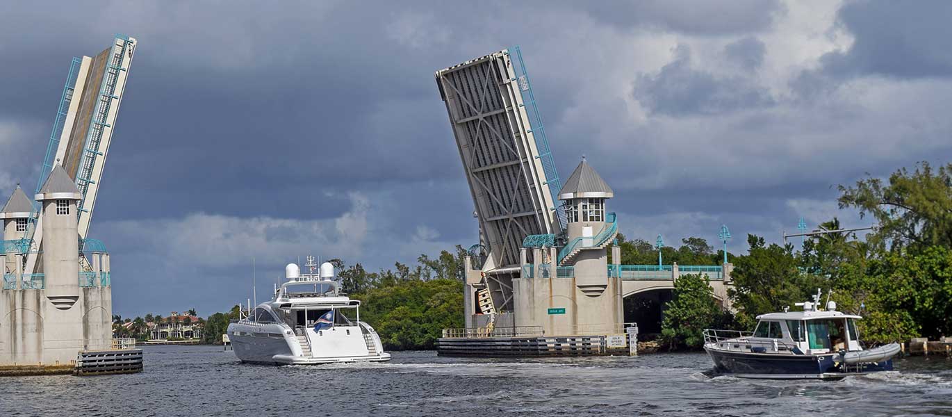 Powerboat Cruisng Under Open Drawbridge 2.ashx