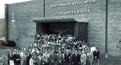 The boatus staff taking a picture in front of the office building
