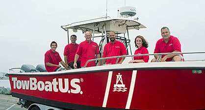 A group of towboatus employees posing on a towboat