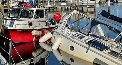 Towboatus vessel helping to refloat sailboat after hurricane Ian